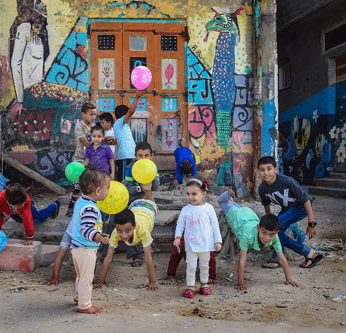 Children playing in an urban courtyard.